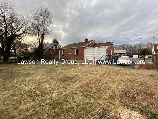 Building Photo - Well Maintained Three Bedroom with Fenced Yard and Shed