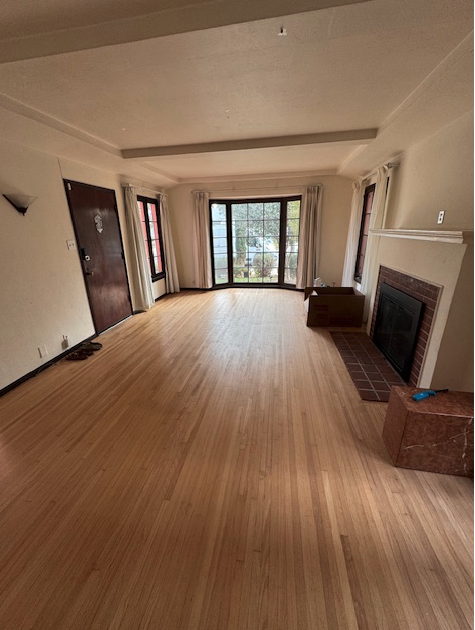 Living room with working, gas fireplace (match lit). - 657 Euclid Ave