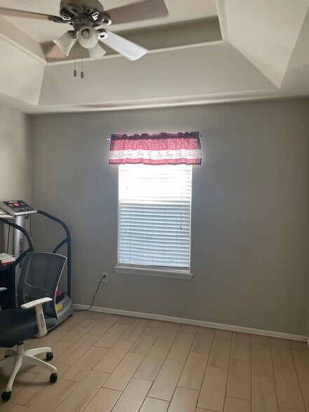 Second bedroom window has twin bed and TV - 2607 Ringold Cir