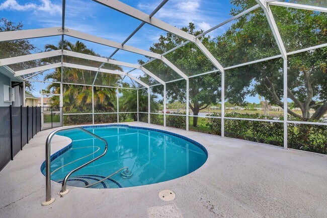 Building Photo - A BOATER'S PARADISE WITH THIS STUNNING 3 BEDROOM, 2 BATH WATERFRONT POOL HOME W/DOCK & BOAT LIFT ...