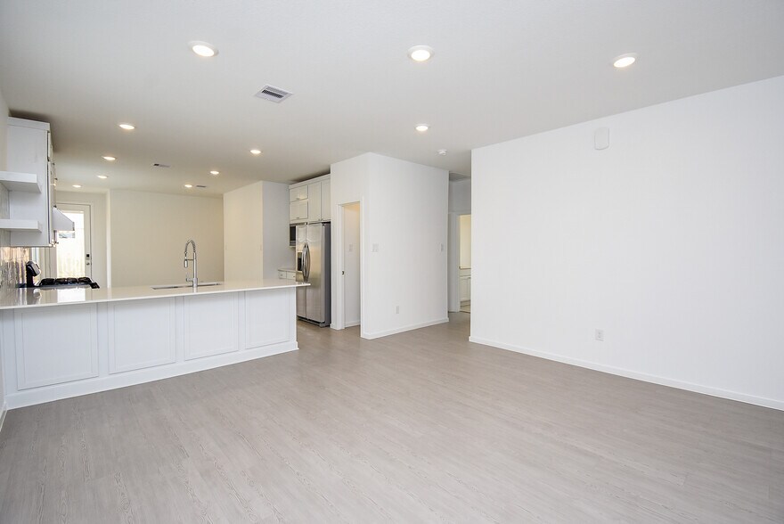 breakfast bar, pantry and living room - 6714 Iron Clover Dr
