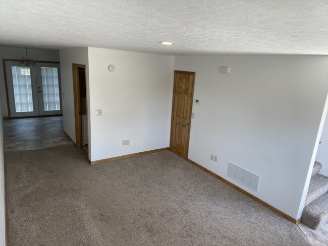 Living Room from corner: Dining Area by French Doors - 118 Willadine Dr