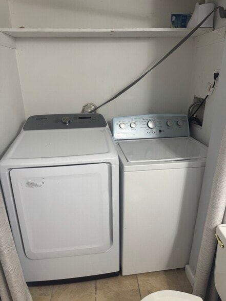 laundry on main level in half bath - 3983 N Quail Ln