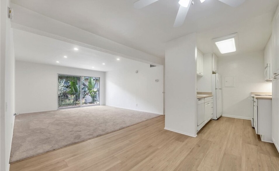 Replaced the carpet with wood vinyl floor - 5460 White Oak Ave