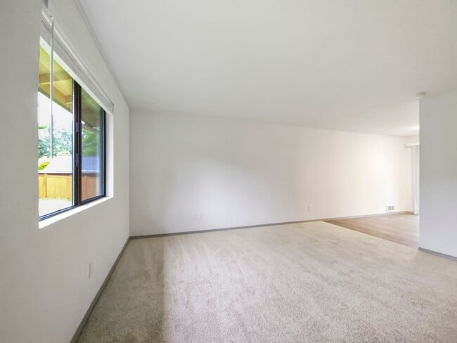 Building Photo - Pet-Friendly 2BR Duplex with Fenced Yard & New Carpets