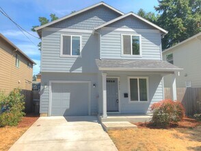 Building Photo - Mt. Scott-Arleta Newer Construction Home with AC, Attached Garage, Fenced Backyard
