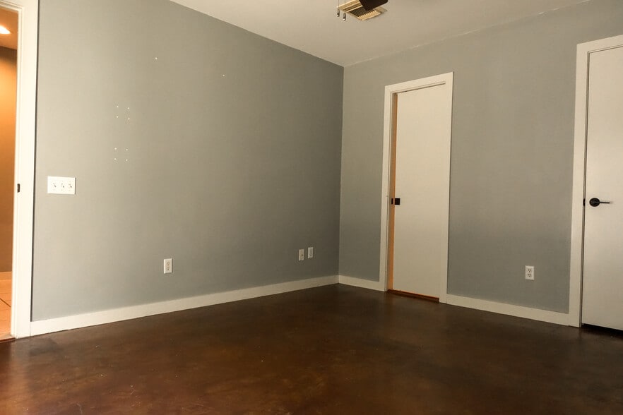 First floor bedroom with a slide door to the connected full bath and large walk-in closet to boot! - 918 Ruthven St