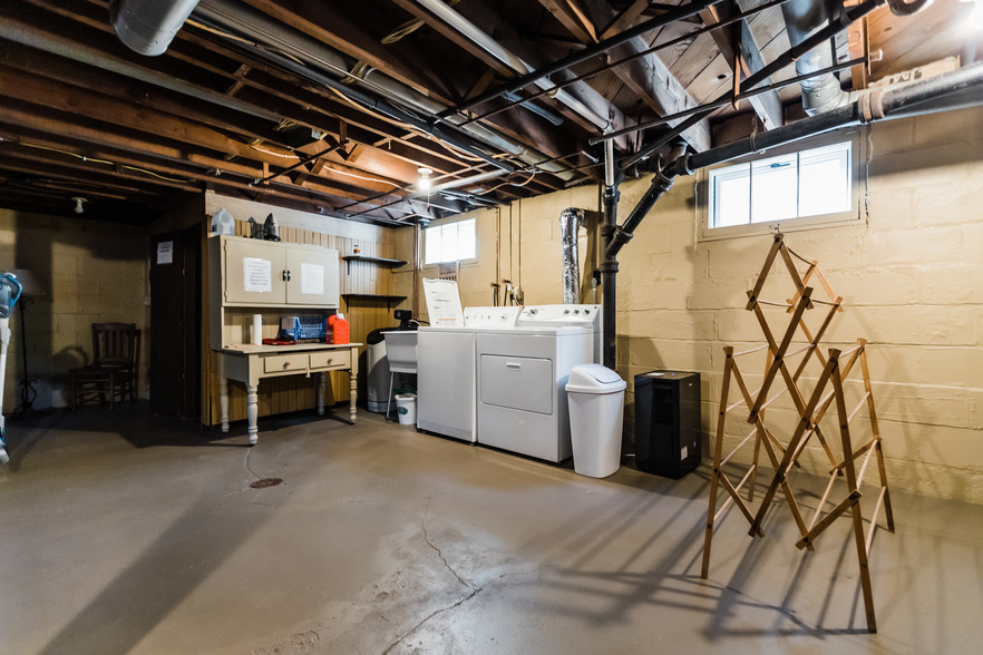 Laundry in maintained unfinished basement - 920 6th Ave SE