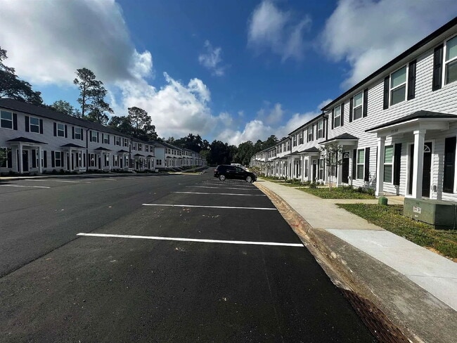 Building Photo - Spacious New 3BR/3BA Condos – Pool & Gym Amenities