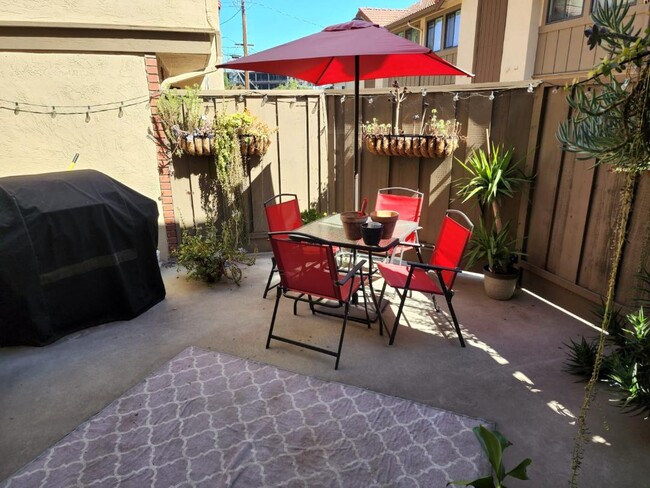 PRIVATE fenced outdoor patio area - 2040 Main St