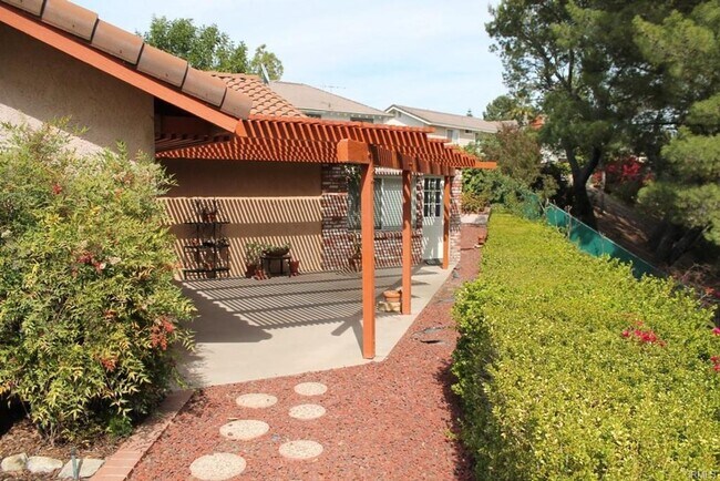 Building Photo - This incredible 4 bedroom single level home with private GATE  entry