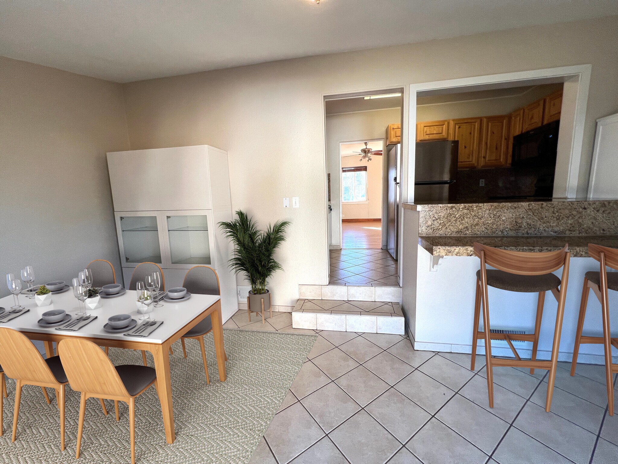 Dining area with bar looking into kitchen and living room. - 5130 Clay St