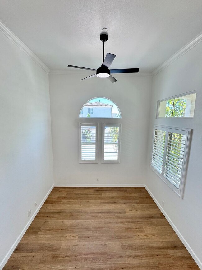 Building Photo - Beautifully Remodel Townhouse with AC & Two Car Garage!