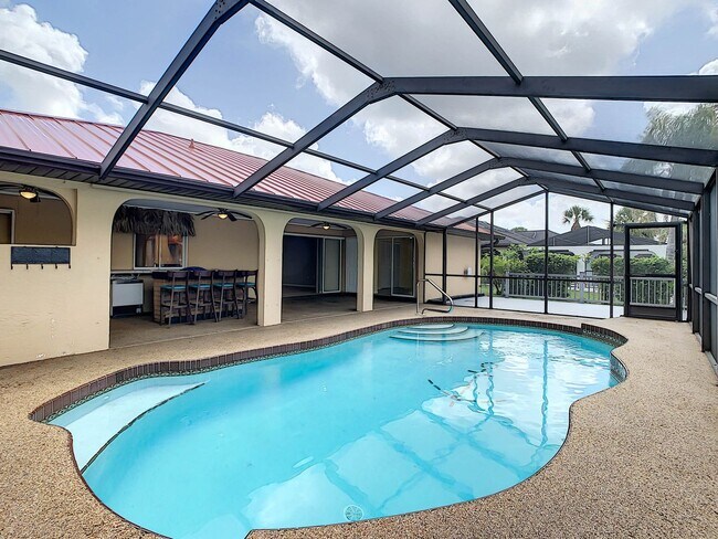 Building Photo - Port Charlotte Waterfront Pool Home - Grea...