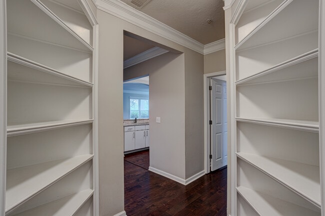 Entrance foyer with two floor-to-ceiling bookshelves - 1850 Cotillion Dr