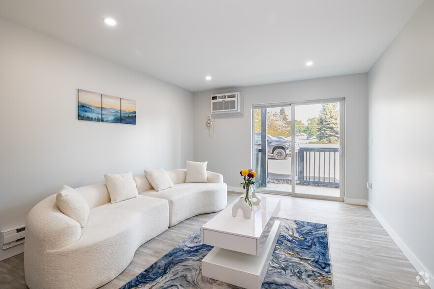 2BR, 2BA - 975SF - East Blue/Gold - Living Room - Arvada Court Apartments - Utilities included!