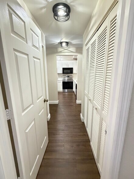 Hall way: closet in the right, laundry on the left - 1096 Woodshire Ln