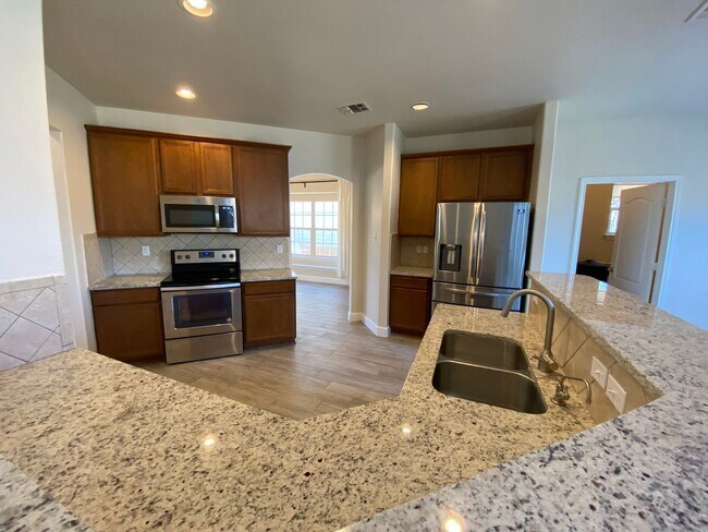 Building Photo - Step into this stunning 4 bedroom, 2.5 bathroom haven that radiates modern elegance and abundant ...