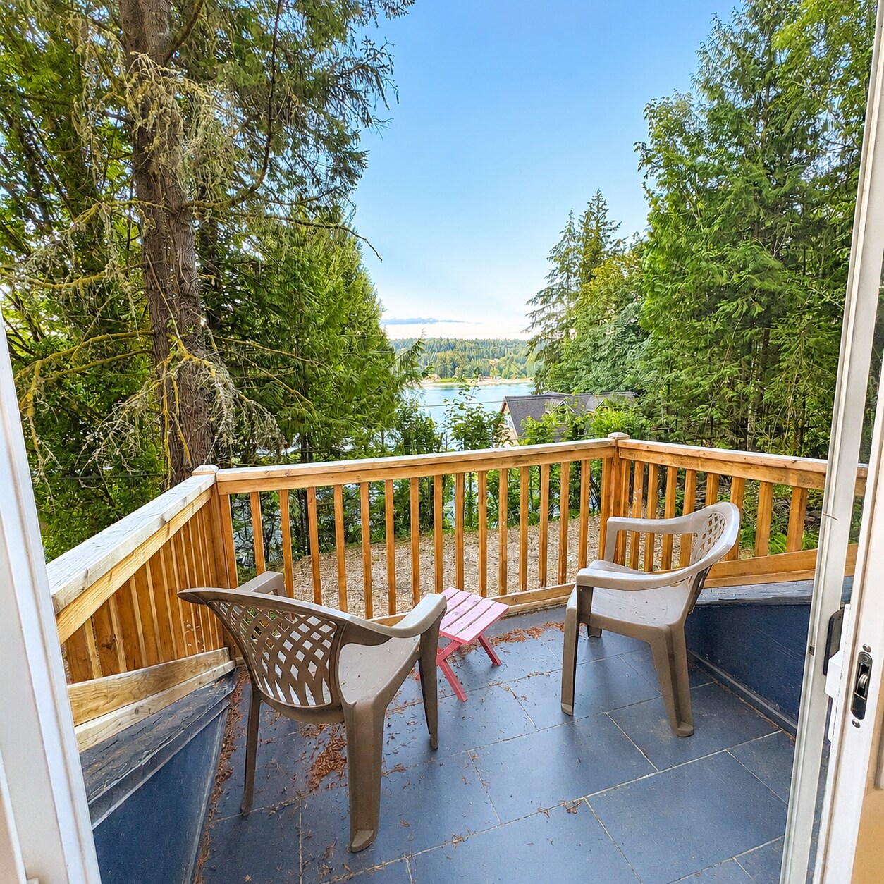 Primary bedroom balcony + water view - 14410 Goodrich Dr NW