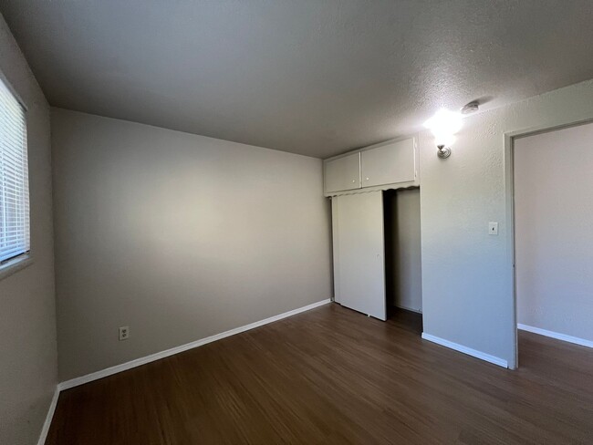 Building Photo - 3 Bedroom House with New Paint, Wood Floor...