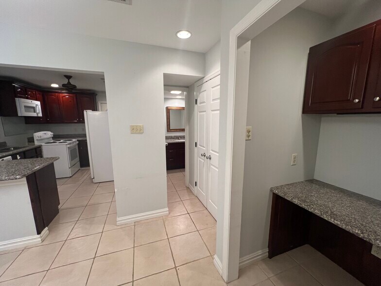 View of kitchen desk and half bath - 6803 Louisville St