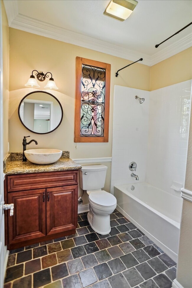 Building Photo - "Spacious 4-Bedroom Retreat with Cozy Fire...