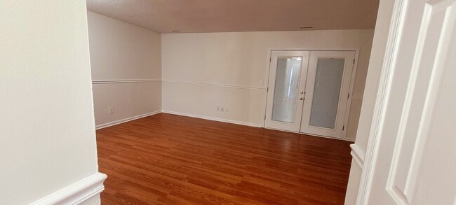 Building Photo - Spacious 3BR Townhome • $2,150 • Fenced Yard + Bonus Room • Prime Location