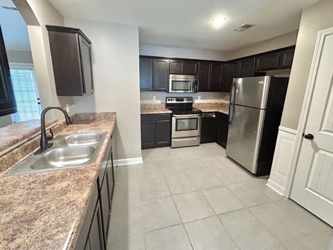 Building Photo - Now Leasing a 4 bedroom 2 bath home in May...