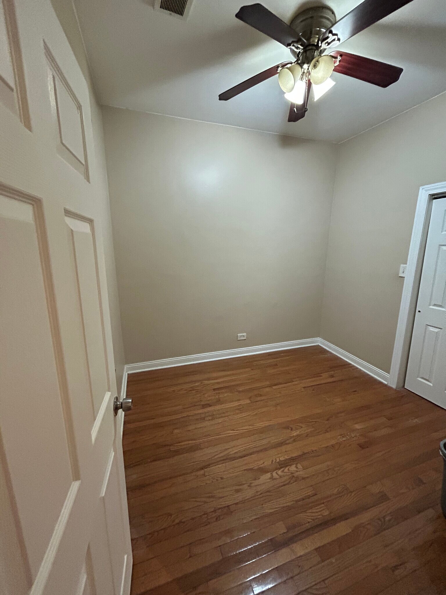Back bedroom featuring ceiling fan - 6630 S Ingleside Ave