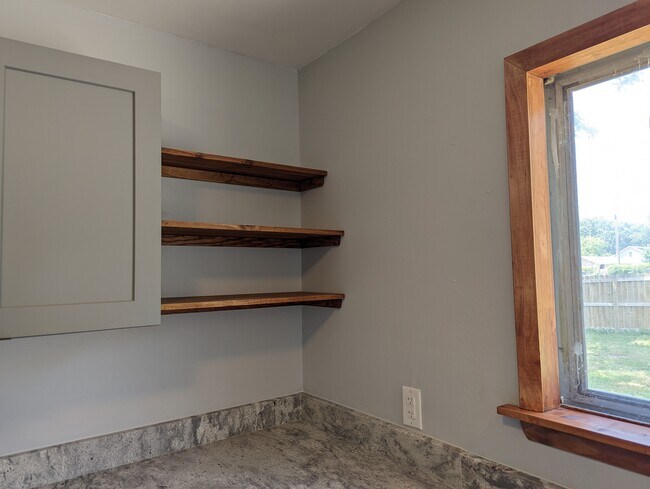 Warm wood accents pay homage to the home's mid-century roots. - 2008 E Huntsville Rd