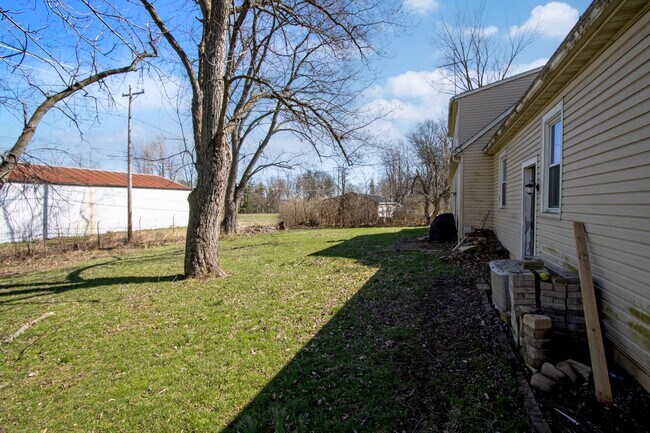 Building Photo - Four Bedroom Single-Family Home