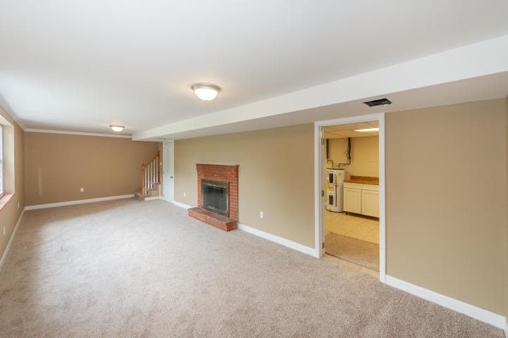 Basement bonus room with functional fireplace - 6917 Cresthill Dr