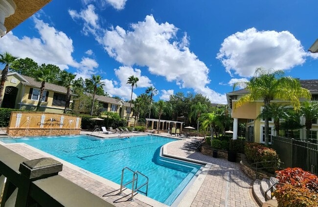 Building Photo - Elegant 1-Bedroom Condo with Lakeside Views in Resort-Style Community