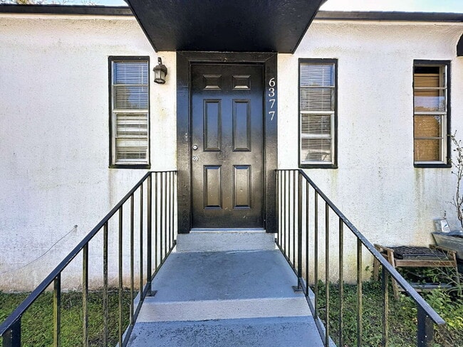 Building Photo - 6377 Lamar Dr