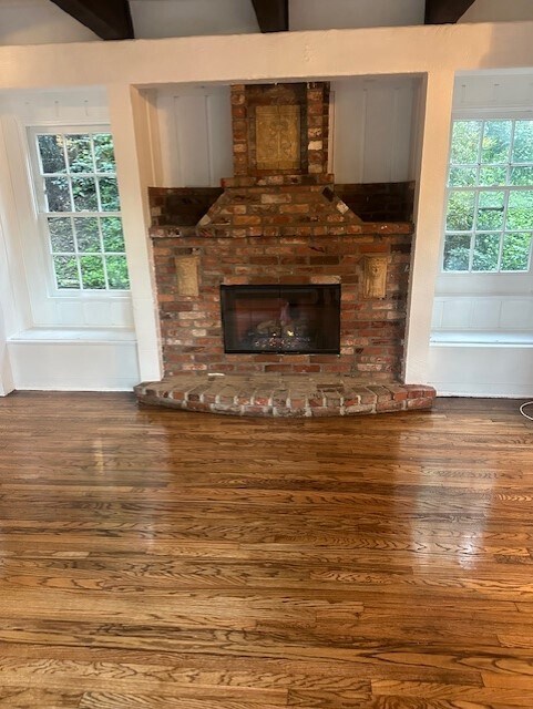 Stunning fireplace frame by windows and storage benches - 367 Beloit Ave