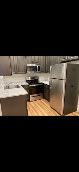 Kitchen with stainless appliances - 8812 N Edison St