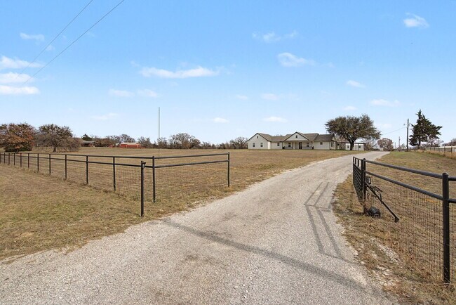 Building Photo - “Farmhouse Charm Meets Modern Luxury on a Serene 5-Acre Lot!”