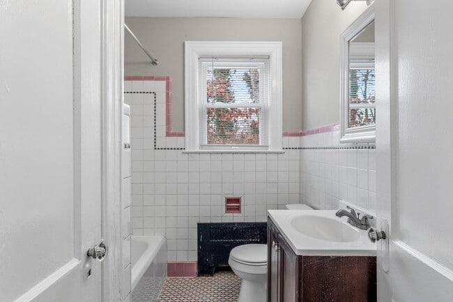 Building Photo - SW, Large Brick Two Bedroom PLUS Two Sun-Rooms, Hardwoods, LR & Separate DR, Fire Place!