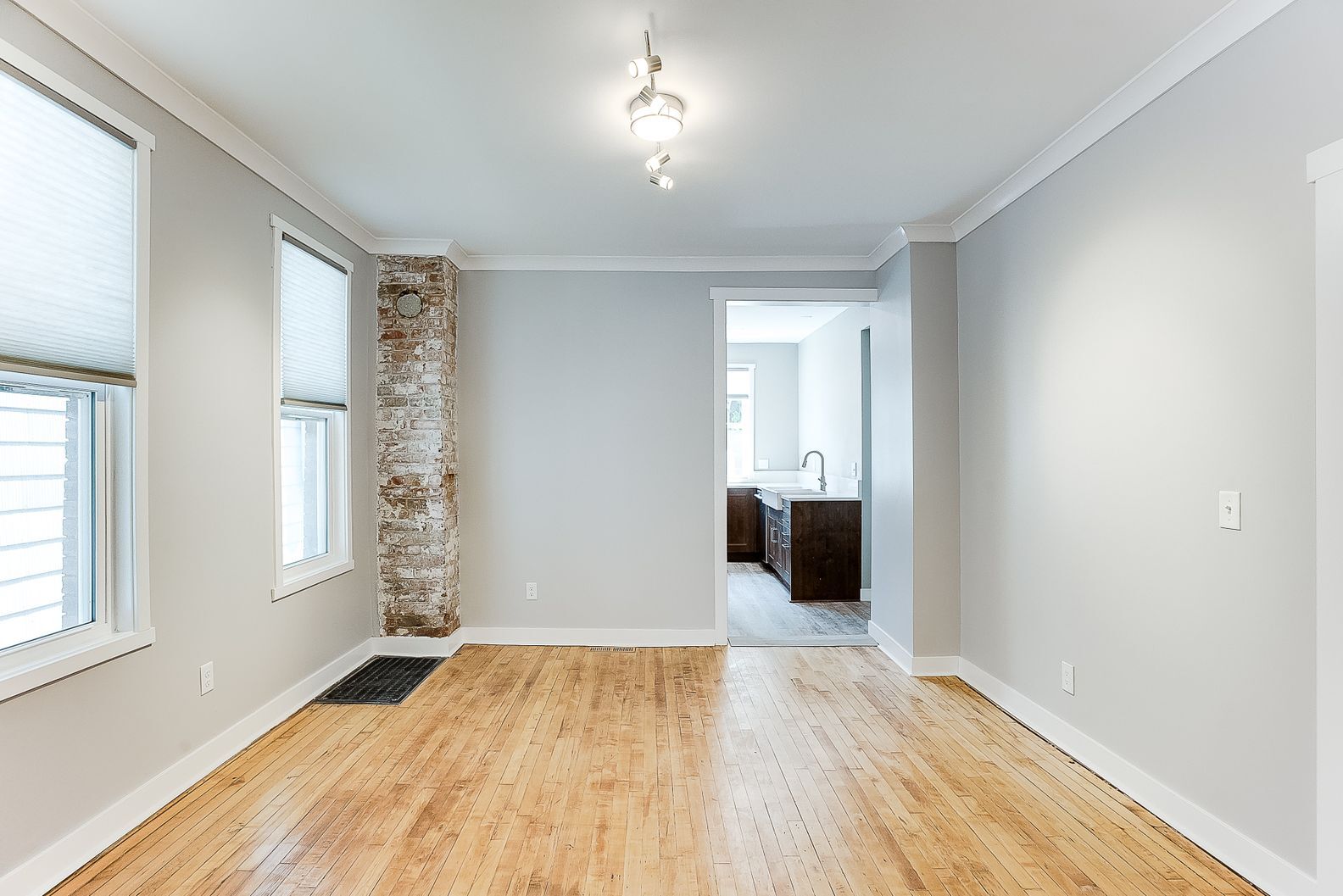 Dining room and exposed brick chimney - 1222 7th St W