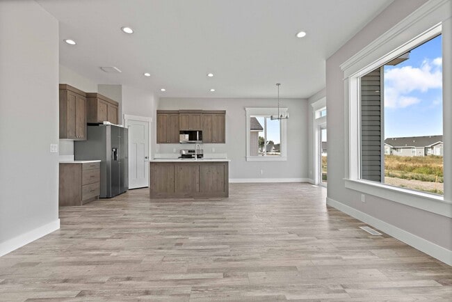 Building Photo - NEW HOME with large garage stalls and unfinished basement for additional storage