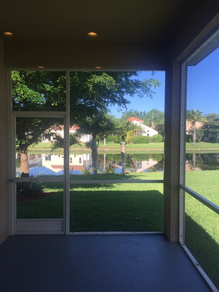 Screened porch over looking lake - 9716 Casa Mar Cir