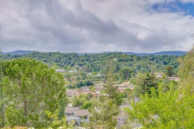 Building Photo - Remodeled 5 Bedroom Home with Heated Pool, Hillside Views, Solar, and Sunrise and Sunset Views in...