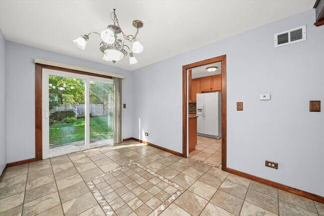 Building Photo - Updated Grayslake Home with Sunroom and Fl...