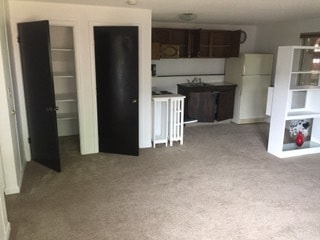 Kitchen in living room showing storage - Gilcrest Apartments - Utilities Included