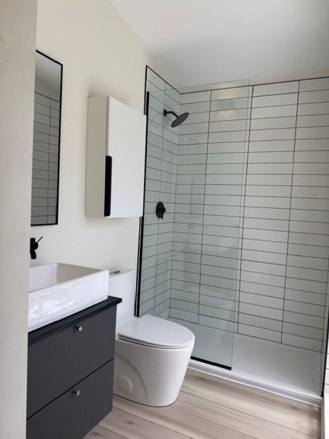 Building Photo - Vaulted Ceilings & Hardwood Floors in This Charming Indianapolis L
