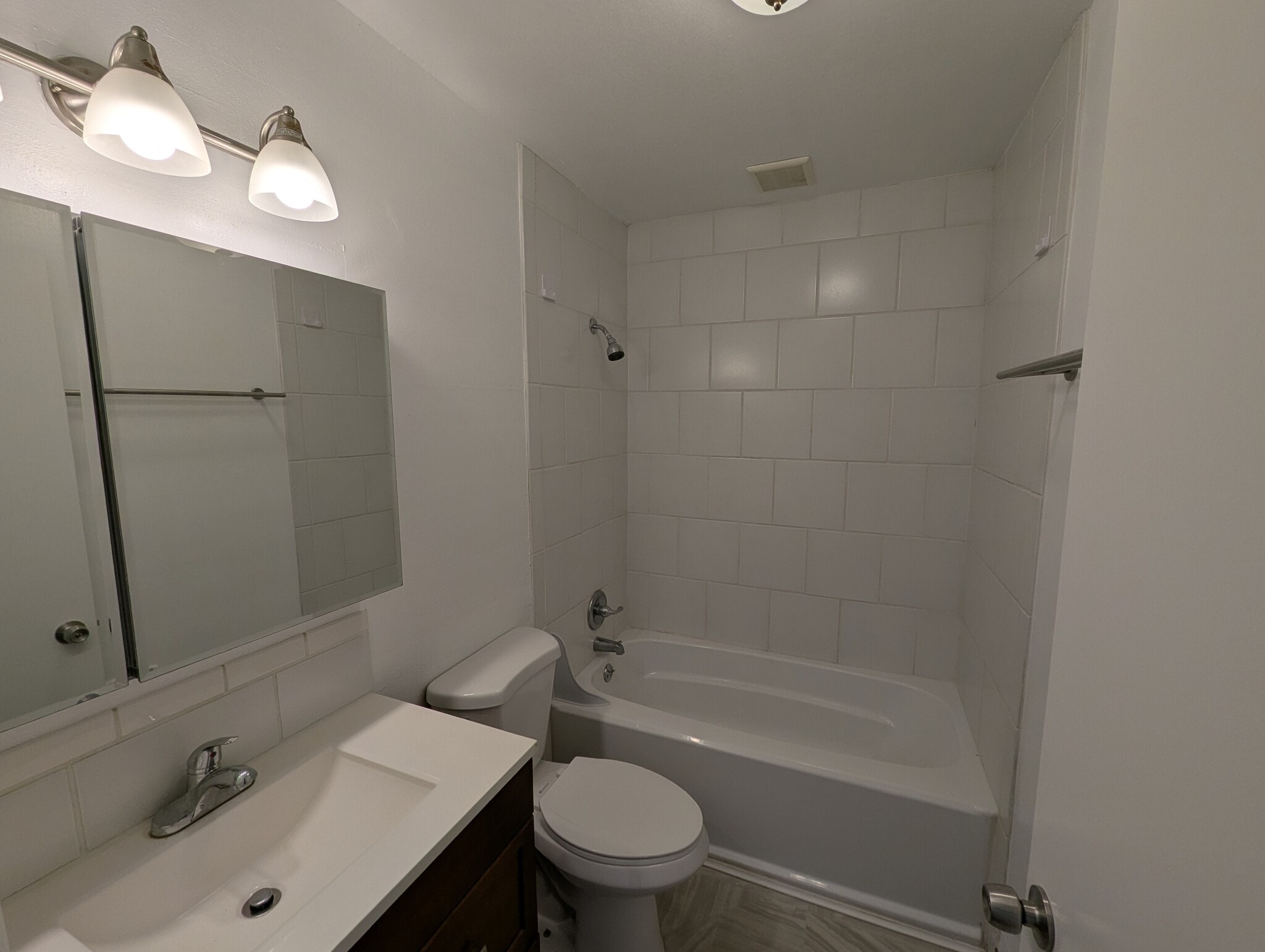 Bathroom with deep soaking tub and medicine cabinet for extra storage - 1626 Southeast Lexington Street