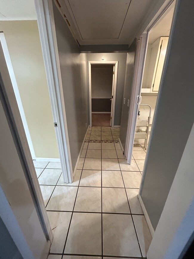 Hallway leading to main bedroom and back door - 821 Baier St