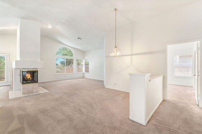 Building Photo - Vaulted Ceilings, Cozy Fireplace & Desirable Single-Story Living Near The Lakes!