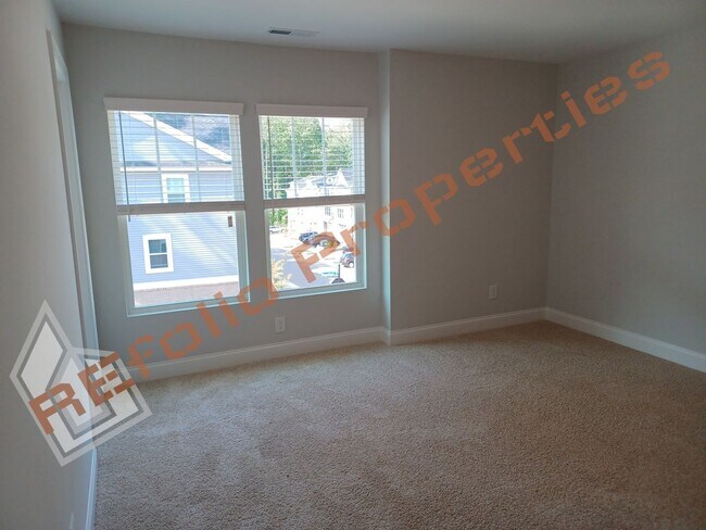 Building Photo - Built in 2022! 3 Story 3 Bedroom 1-Car Gar...
