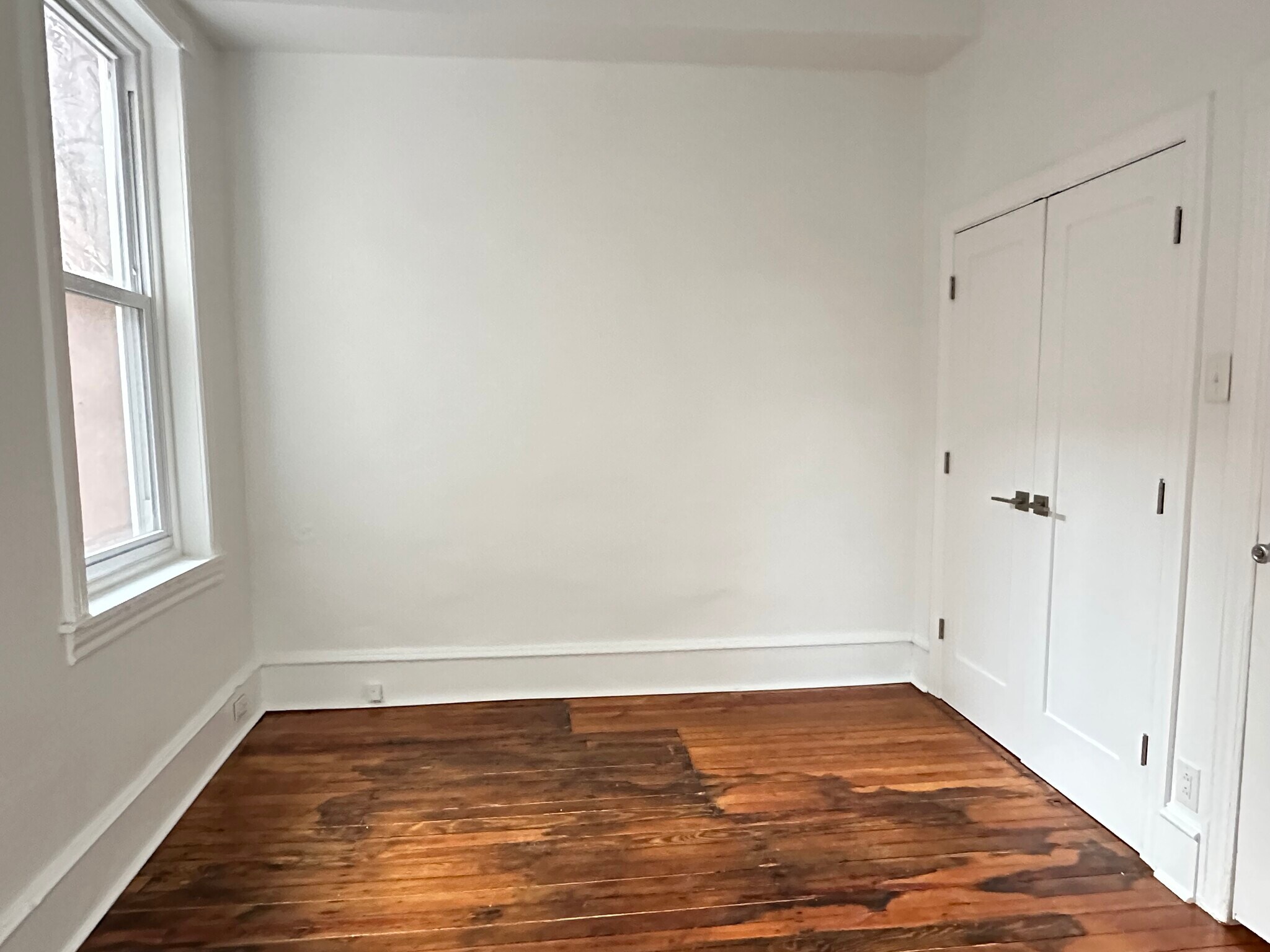 Bedroom at the rear of the apartment, which leads out to the private back garden area. Measures 11'3 - 336 Fitzwater St